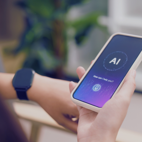 Someone holding a phone with AI interface pulled up