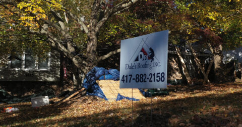Dale's Roofing sign in yard